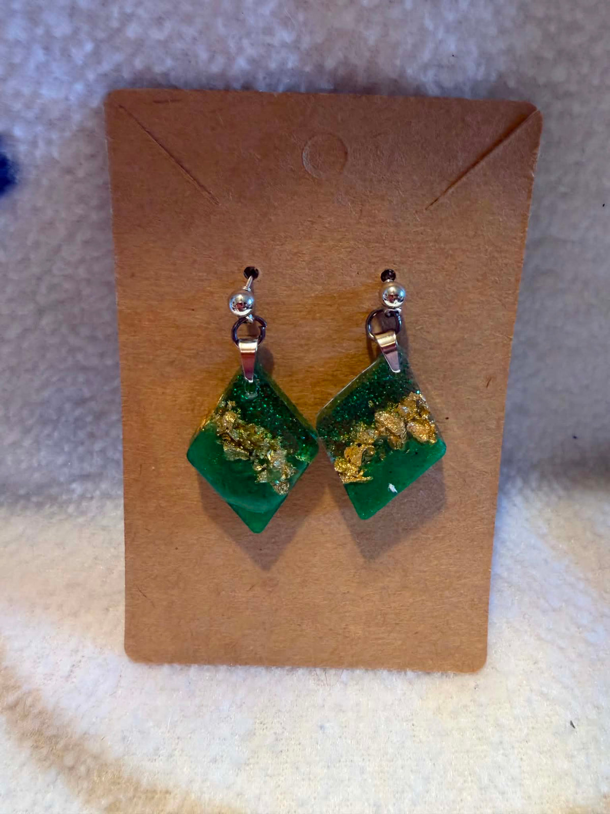 Handcrafted emerald green and gold foil diamond-shaped resin earrings by Crescent Moon Creations