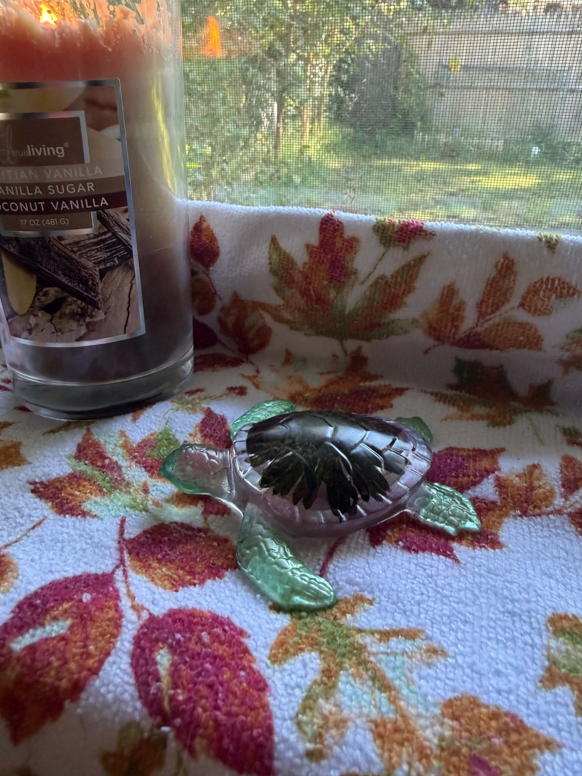 Sea Turtle Figurine with a Black-Eyed Susan