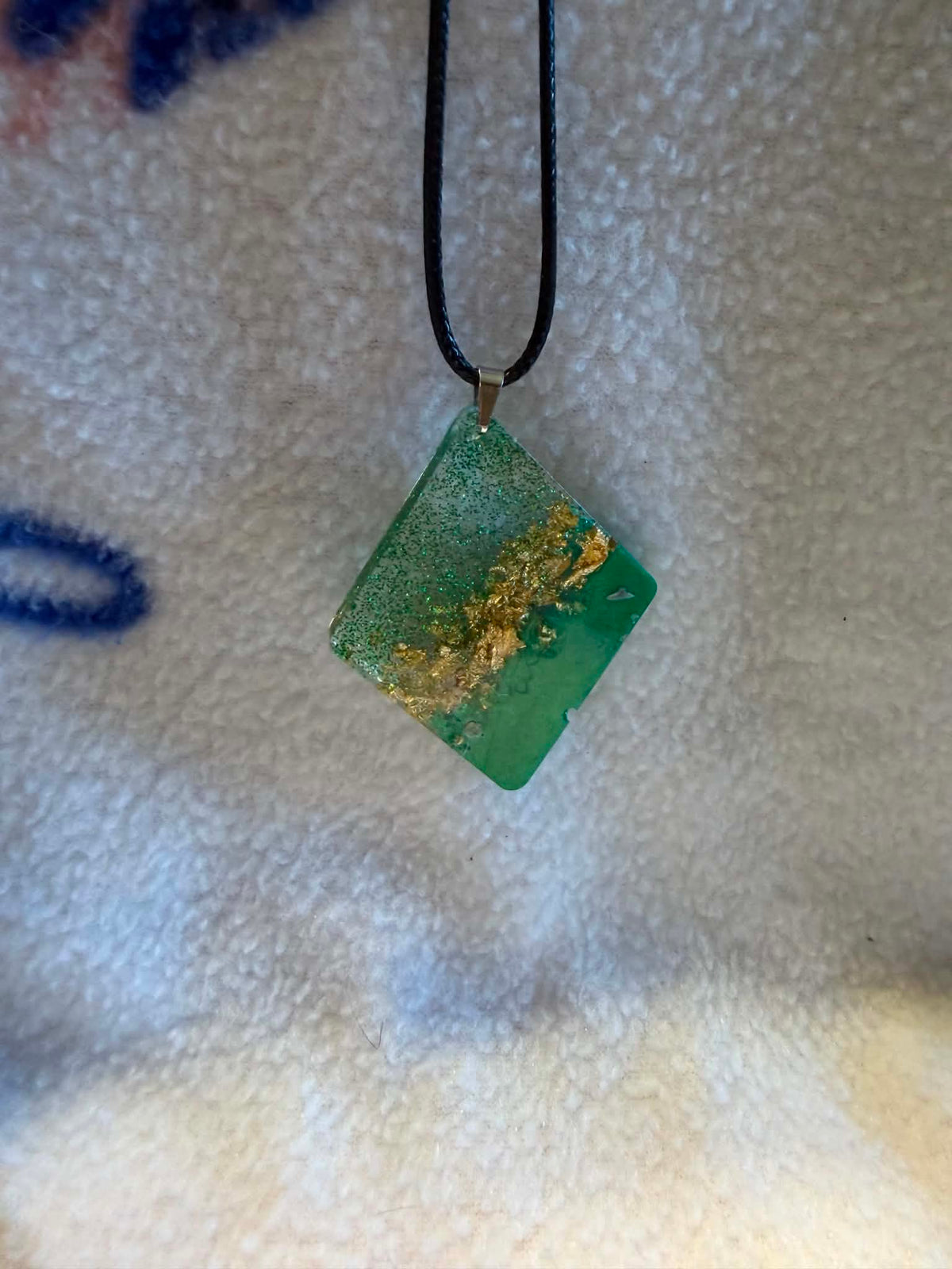 Handcrafted emerald green and gold foil diamond-shaped pendant necklace by Crescent Moon Creations
