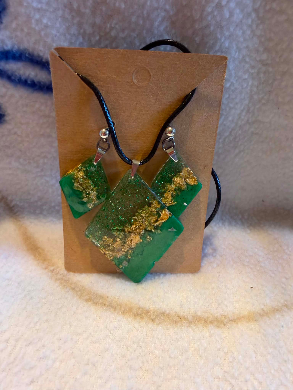Handcrafted emerald green and gold foil diamond-shaped resin earrings and pendant necklace jewelry set by Crescent Moon Creations