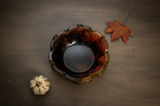 Black and orange Halloween rose lotus resin trinket bowl styled in a flat-lay scene
