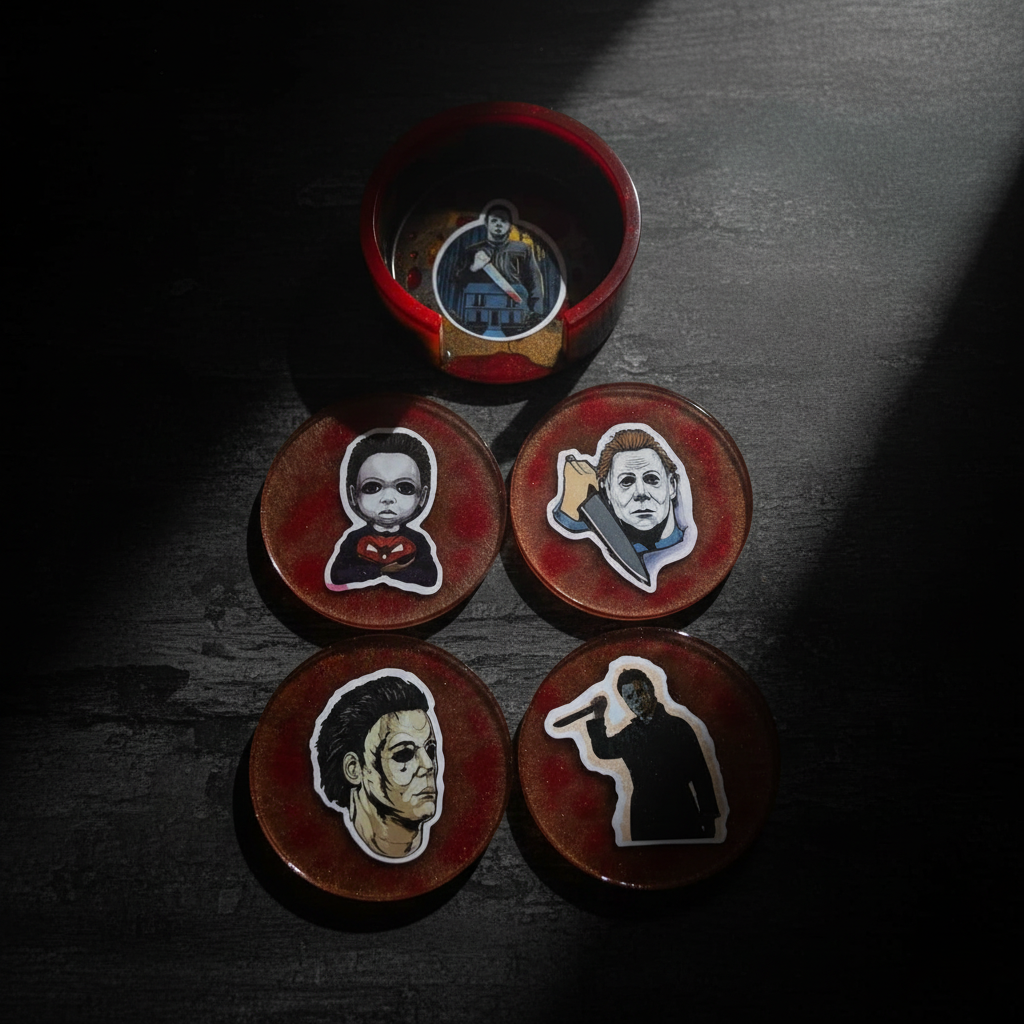 Top-down flat lay of a handmade Michael Myers epoxy resin coaster set with its blood-red holder