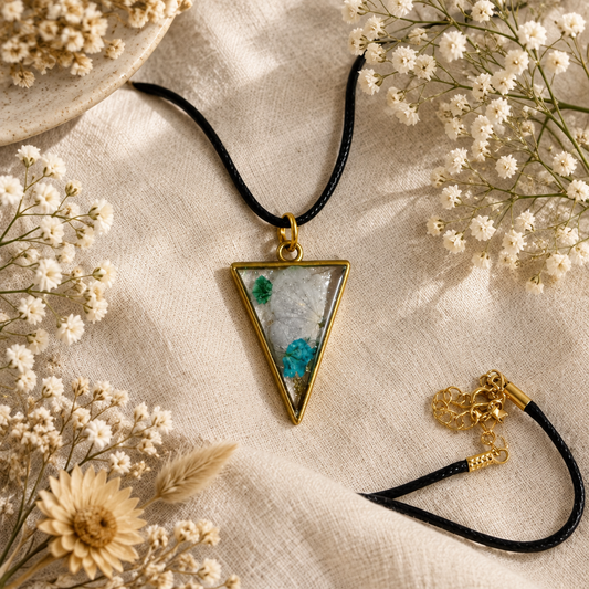 Gypsophila triangle resin pendant necklace on cream linen with baby's breath flowers