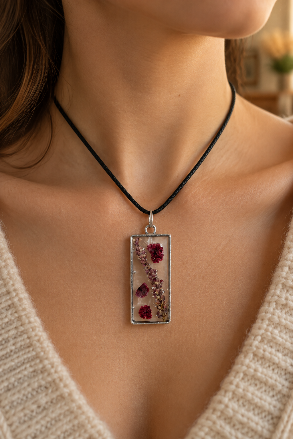 Lifestyle shot of the pressed-flower pendant necklace being worn